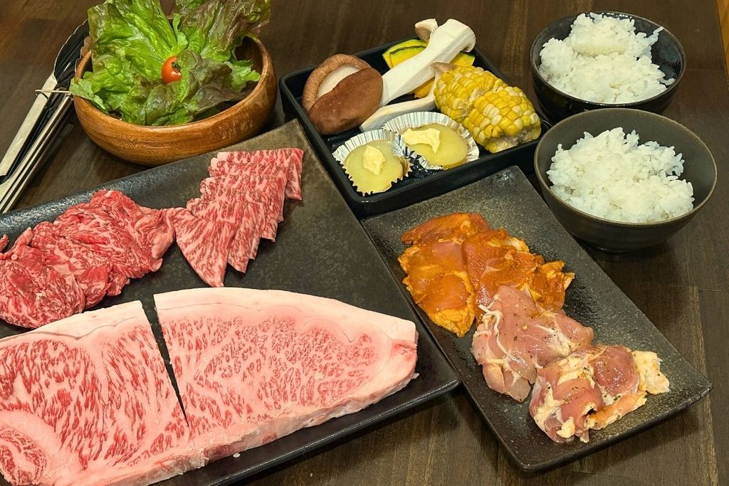 Wagyu beef served with vegetables and condiments