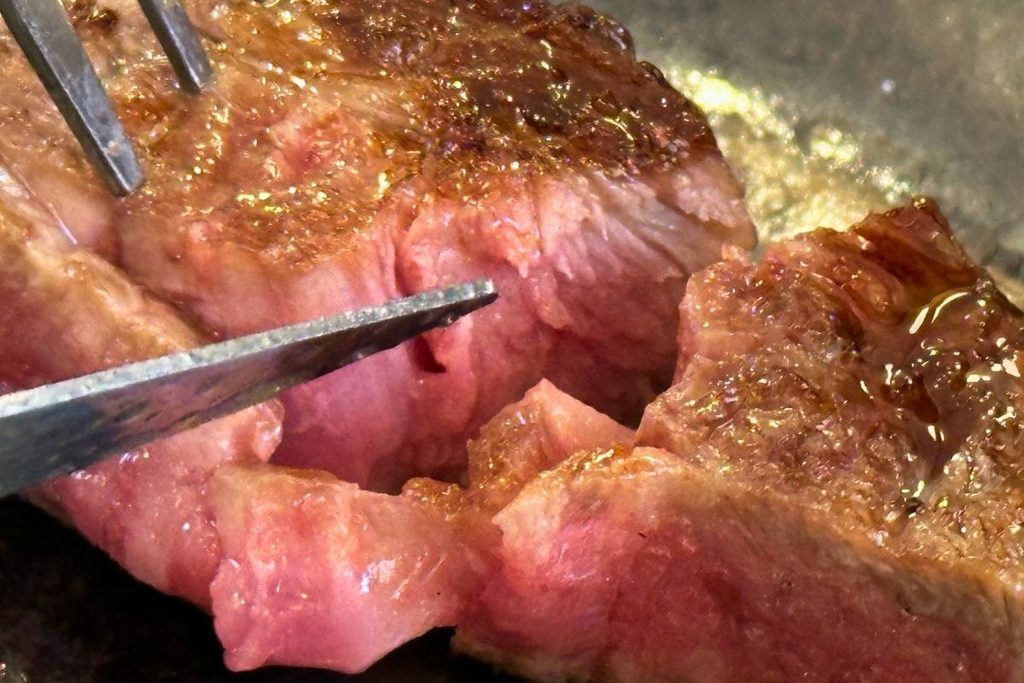 Close-up of Wagyu beef cooking on the grill
