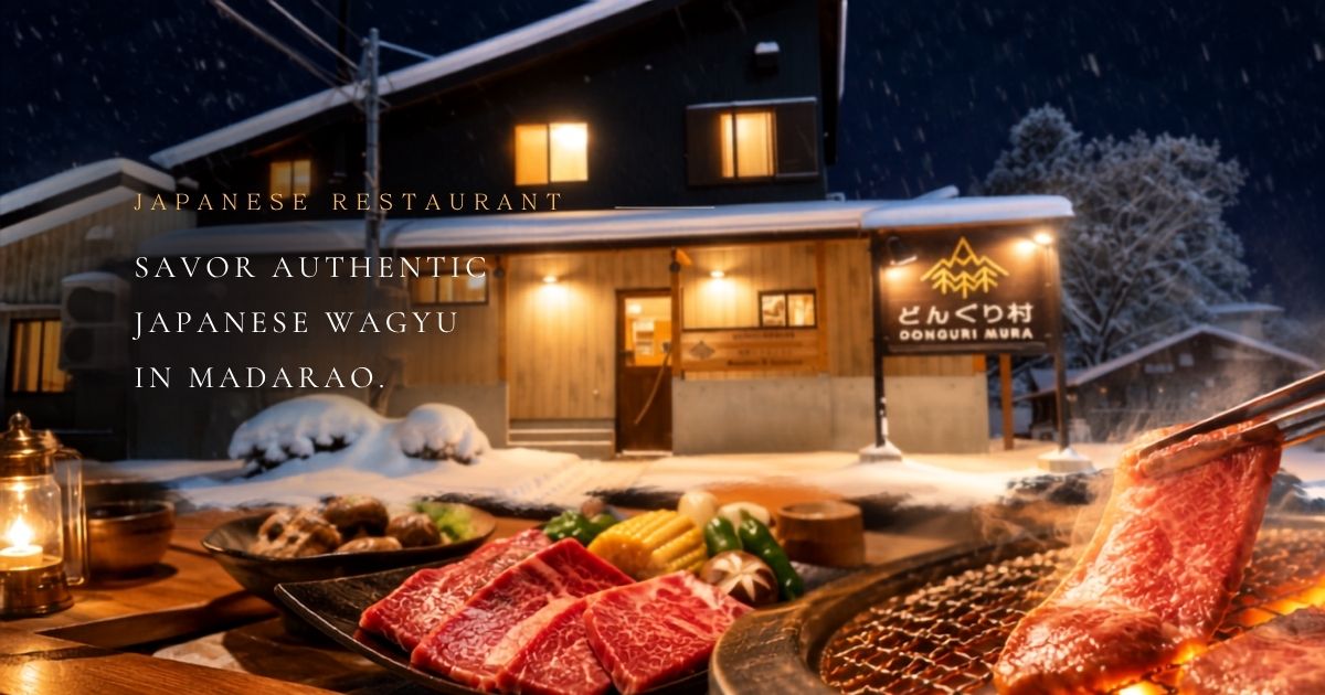 Snow-covered Donguritei Japanese restaurant at night in Madarao, with grilled Japanese Wagyu beef in the foreground.