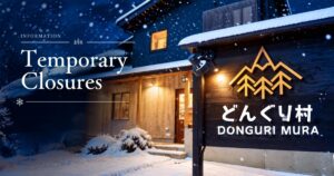 Snow-covered Dongurimura sign outside the restaurant in Madarao.