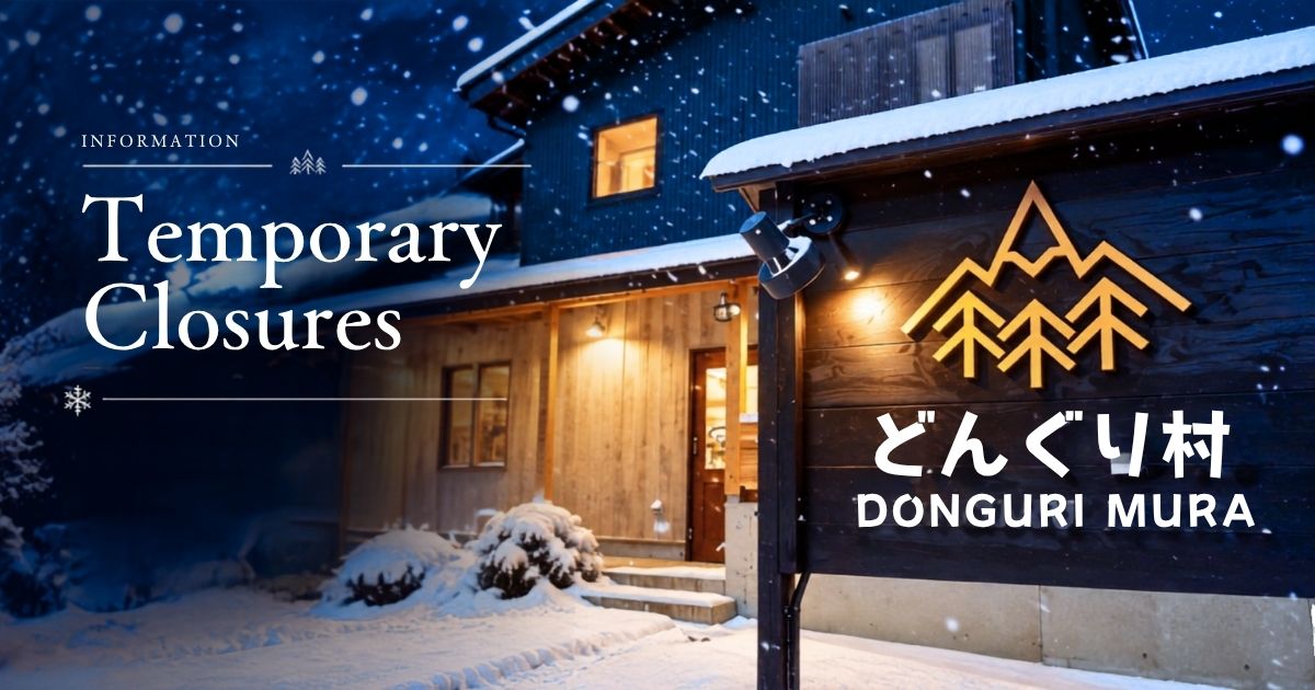 Snow-covered Dongurimura sign outside the restaurant in Madarao.